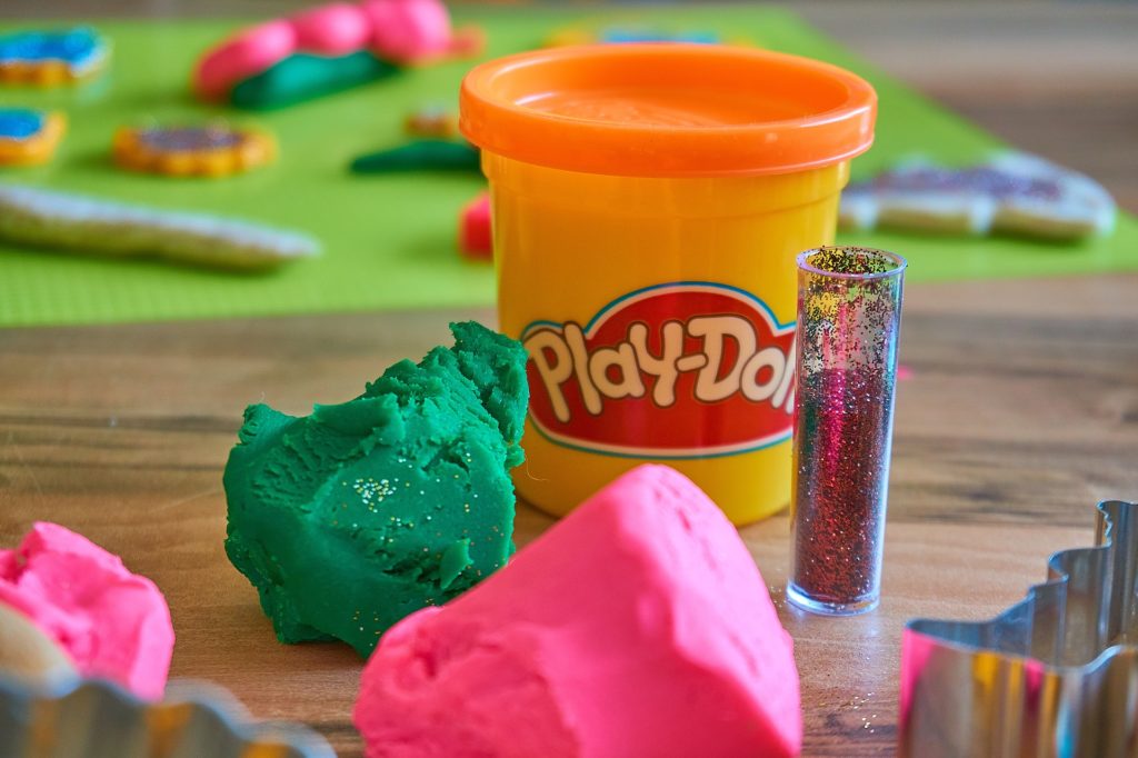 green and pink play-doh in craft room